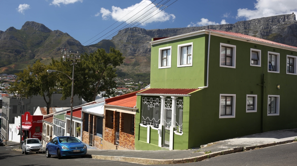 The Bo Kaap neighbourhood sits under the spectacular Table Mountain [Erica Jenkin/Al Jazeera]