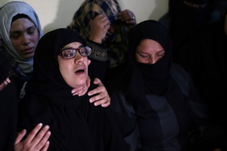 Relatives of Palestinian boy Ahmed Abed mourn during his funeral in Khan Younis in the southern Gaza Strip