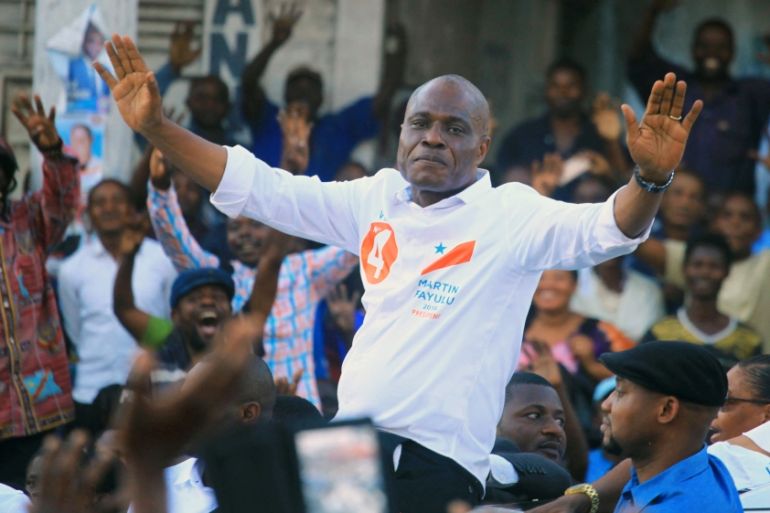 Congolese joint opposition Presidential candidate Martin Fayulu waves to supporters as he campaigns in Goma
