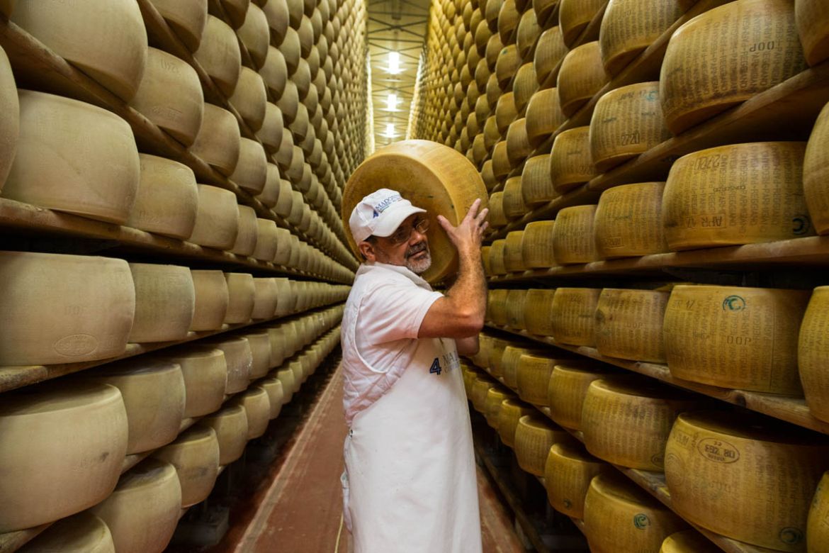 Cheese making is a job that requires great dedication and the Indian cheese makers and their Italian counterparts work 365 days a year. [Erik Messori/CAPTA/Al Jazeera]