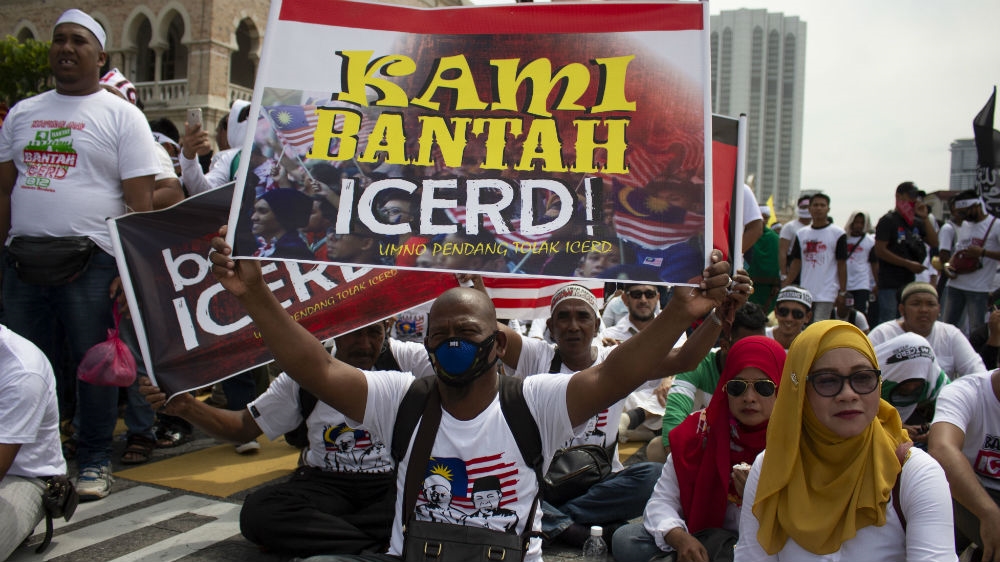 Malays took to the streets of Kuala Lumpur on Saturday to show their opposition to a key UN anti-discrimination treaty. Police estimated the turnout at about 55,000 [Kate Mayberry/Al Jazeera]