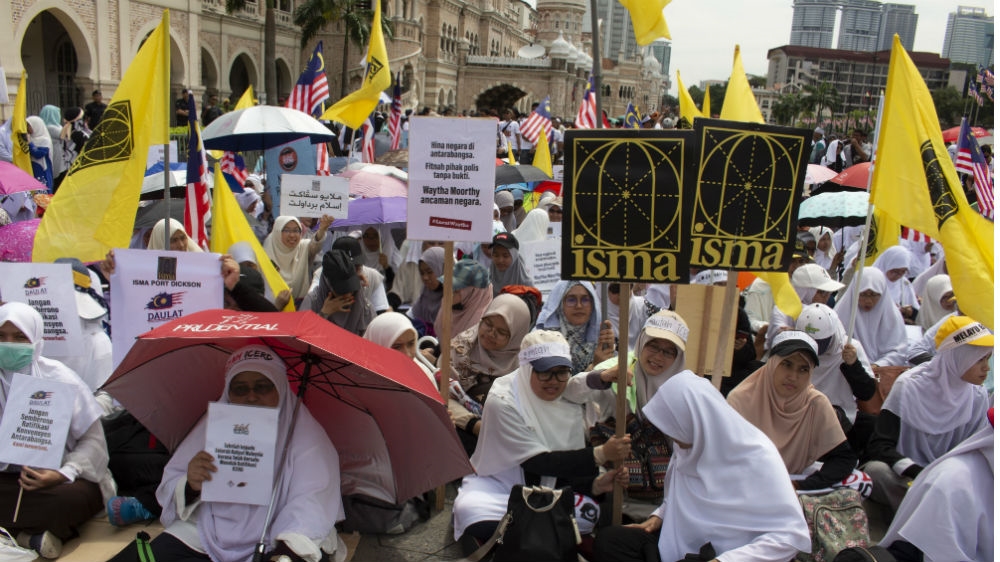 Conservative Malays protested in Kuala Lumpur last year against the government's plan to sign up to a major UN anti-discrimination treaty [Kate Mayberry/Al Jazeera]