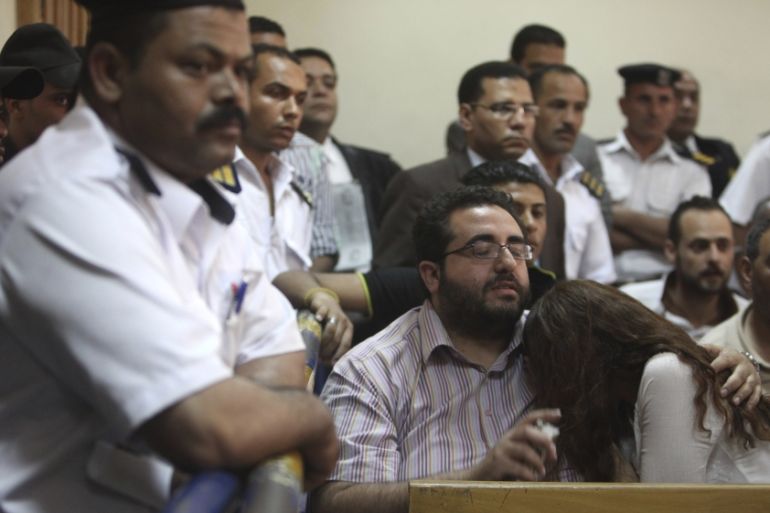 Friends of Egyptian suspects react as they listen to the judge''s verdict at a court room during a case against foreign non-governmental organisations (NGOs) in Cairo June 4, 2013. An Egyptian court se