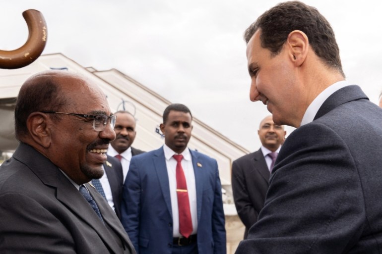 Syrian President Bashar Assad, right, shakes hands with Sudan''s President Omar al-Bashir in Damascus