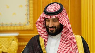 MBS was originally welcomed as a reformer by Western voices, though his reputation was severely tarnished following the murder of journalist Jamal Khashoggi [File: Bandar Algaloud/ Saudi Royal Court Handout/Reuters]