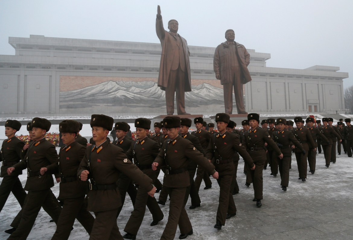 North Korean soldiers leave after paying their respects to the bronze statues of their late leaders Kim Il Sung and Kim Jong Il at Mansu Hill Grand Monument in Pyongyang, North Korea, Monday, Dec. 17,
