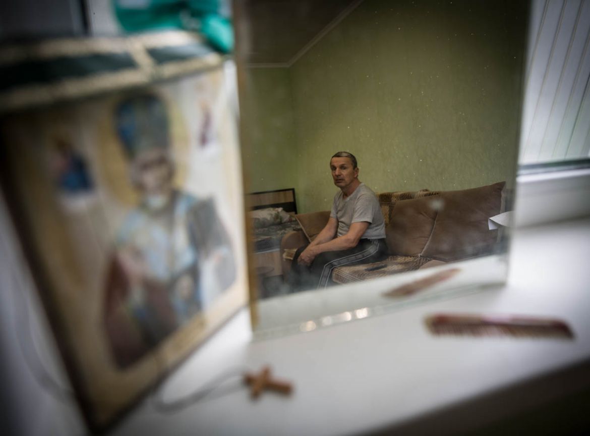 Vasyl Akymenko, 69, lives in the frontline village of Stanytsia Luhanska. In September 2014 his house was destroyed by large shelling and his wife died under the rubble. “Only on the fourth day after