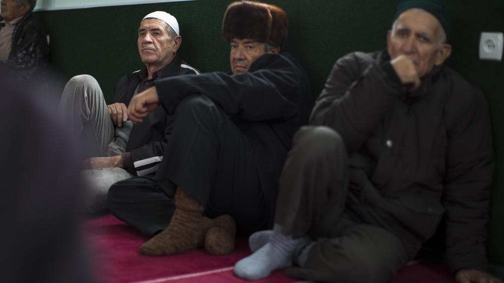 Crimea's Muslim Tatars have been frustrated by police searches, kidnappings, killings, and forced exile of their leadership [Alexander Zemlianichenko/AP]