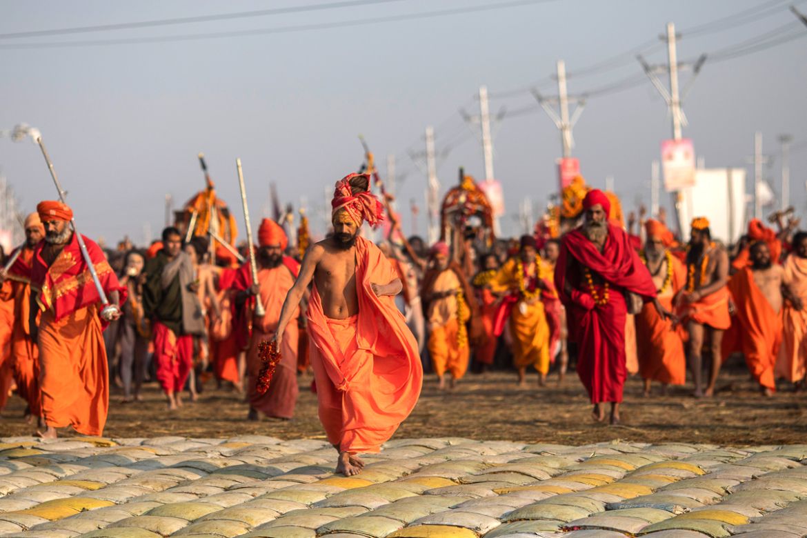 Hindu holy men arrive for ritualistic dip on auspicious Makar Sankranti day during the Kumbh Mela, or pitcher festival in Prayagraj, Uttar Pradesh state, India, Tuesday, Jan.15, 2019. The Kumbh Mela i