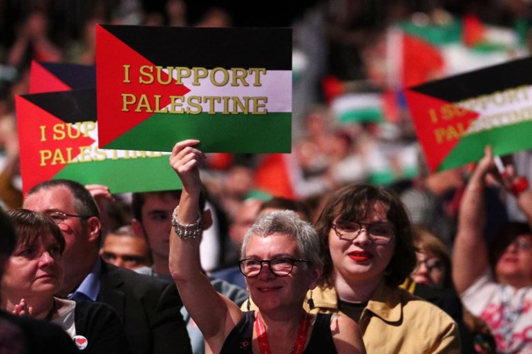 Delegates hold up placards in support of Palestine at the Labour Party''s conference in Liverpool, Britain, September 25, 2018. REUTERS/Hannah McKay
