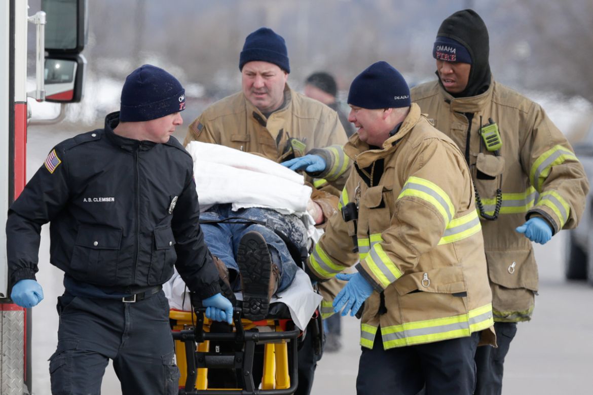 First responders evacuate a person found in sub-freezing temperatures on the banks of Carter Lake, in Omaha, Neb., Wednesday, Jan. 30, 2019. A deadly arctic deep freeze enveloped the Midwest with reco