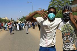 Sudanese demonstrators chant slogans near the home of a demonstrator who died of a gunshot wound sustained during anti-government protests in Khartoum