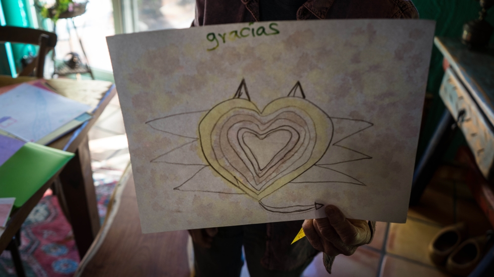 A painting given to Shura Wallin by a migrant child at the border [Patrick Strickland/Al Jazeera]