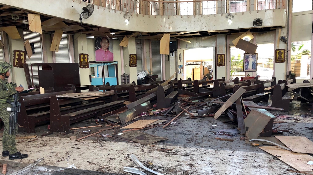 The first bomb went off in or near the cathedral of Jolo, followed by a second blast outside the compound as government forces responded to the attack [Philippine army/AFP]