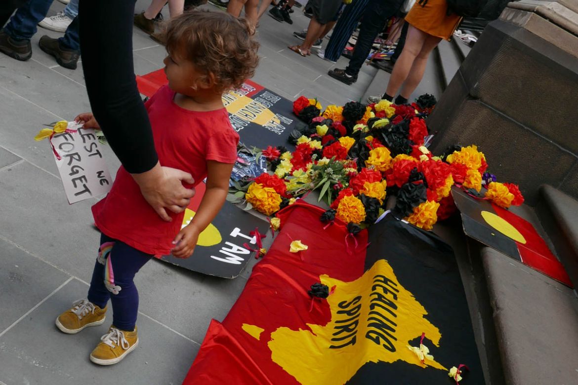 Flowers were also laid to pay respects to the many Aboriginal people killed as part of colonisation, including the Stolen Generations, where thousands of Aboriginal children were removed as ption.