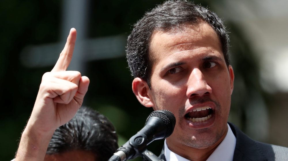 Venezuela's opposition leader Juan Guaido gestures as he speaks during a news conference in Caracas [Carlos Garcia Rawlins/Reuters]
