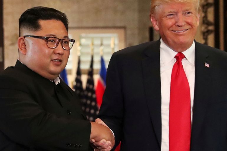 FILE PHOTO: US President Donald Trump and North Korea''s leader Kim Jong Un shake hands after signing documents during a summit at the Capella Hotel on the resort island of Sentosa, Singapore