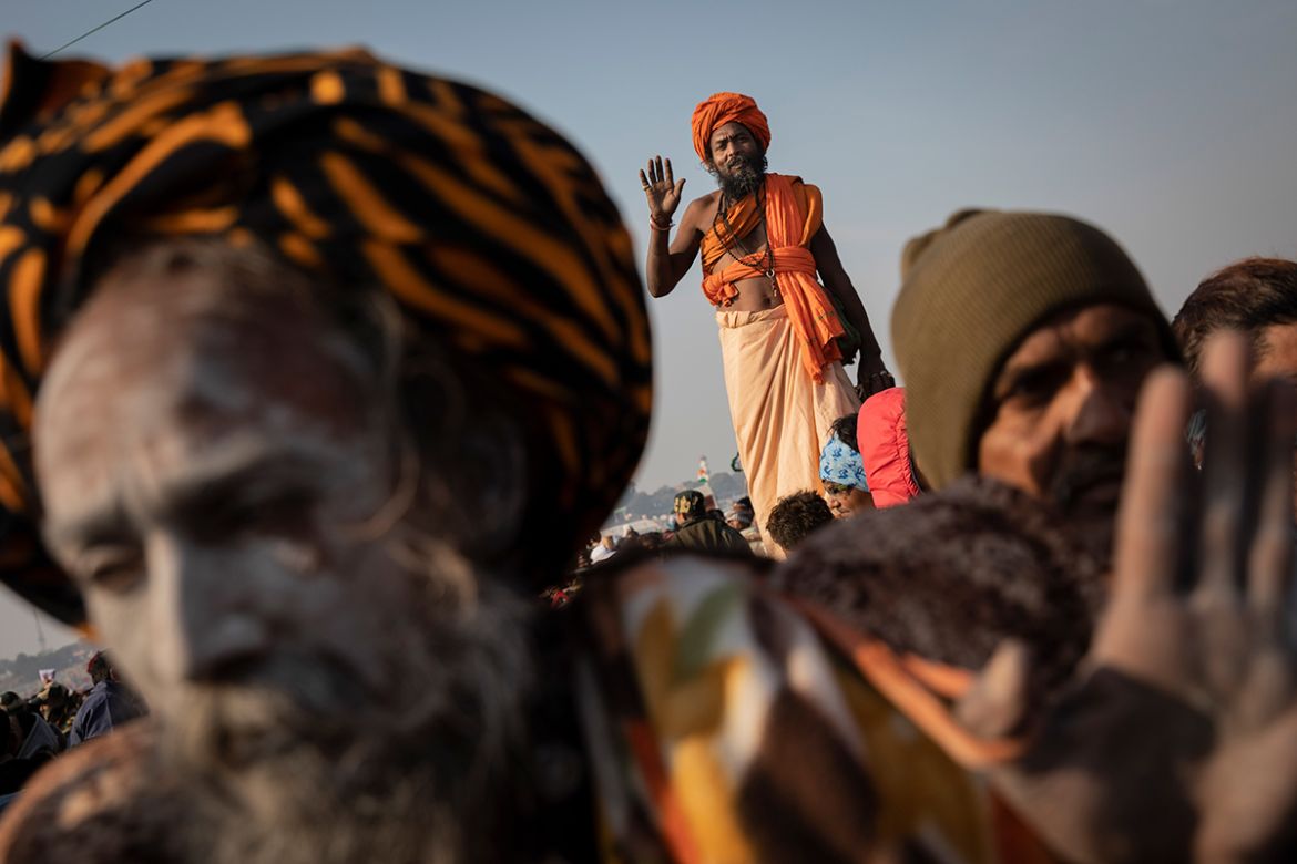 Hindu holy men gather for spiritual-cleansing dip on the auspicious Makar Sankranti day at the Kumbh Mela, or pitcher festival in Prayagraj, Uttar Pradesh state, India, Tuesday, Jan.15, 2019. The Kumb