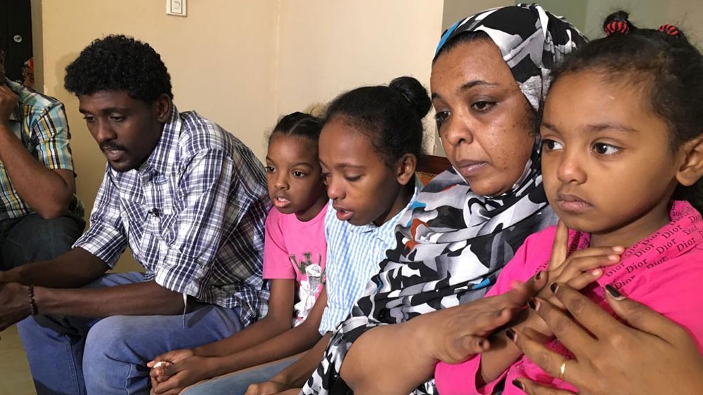 Jihan Abdulrahman, second right, mourns her brother Saleh who was killed by Sudanese security forces in Omdurman on January 9 [Hiba Morgan/Al Jazeera]
