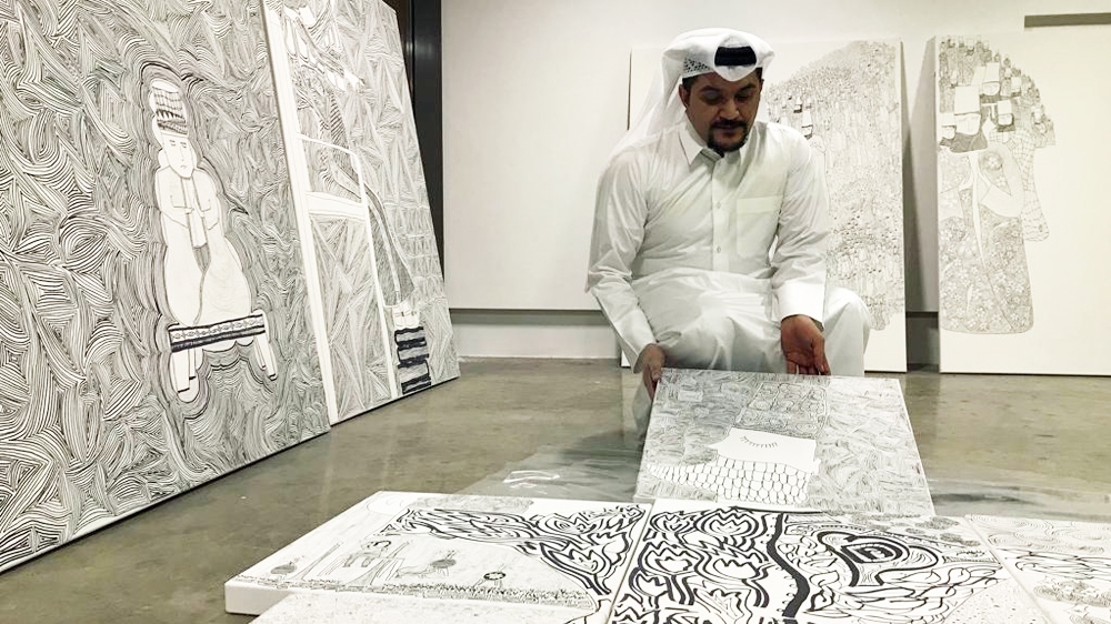 Al Mulla seen here in his studio in Doha [Ayilah Chaudhary/Al Jazeera]