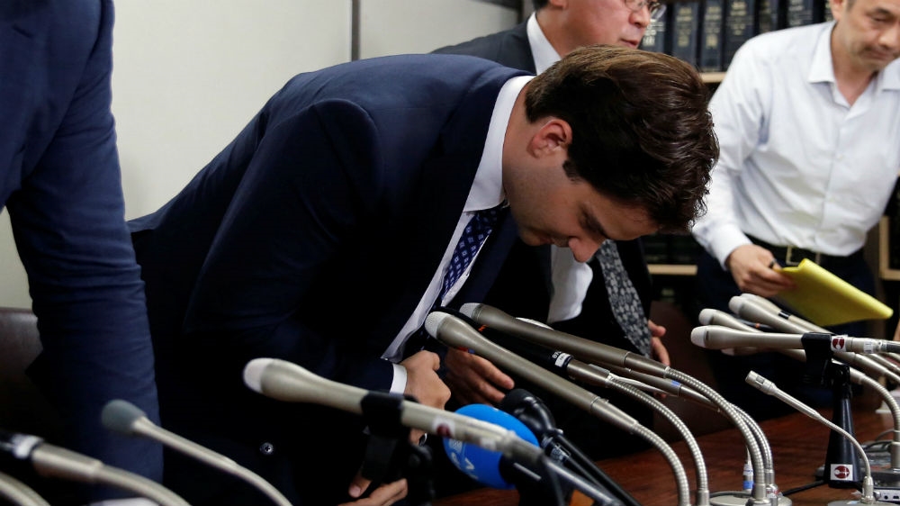 Mark Karpeles, of Mt Gox bows, as he attends a news conference after a trial on charges of embezzlement in Tokyo in July 2017. A court is expected to reach a verdict in March [Toru Hanai/Reuters]