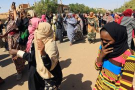 Sudanese women chant slogans near the home of a demonstrator who died of a gunshot wound sustained during anti-government protests in Khartoum