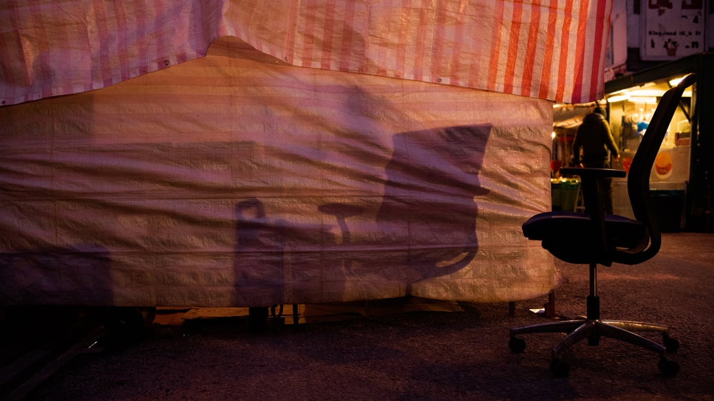 An empty chair in the middle of the Ridley Road Market [Jose Sarmento Matos/Al Jazeera]