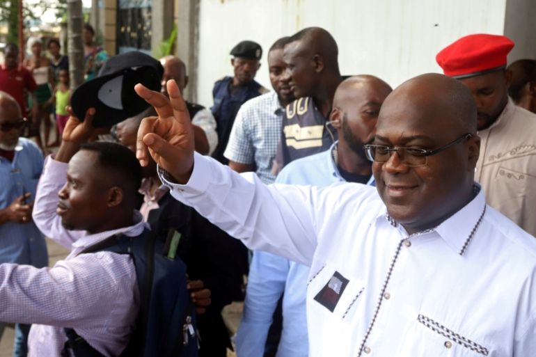 FILE PHOTO: Felix Tshisekedi, leader of the Congolese main opposition party, the Union for Democracy and Social Progress (UDPS), and a presidential candidate, leaves after casting his ballot at a poll