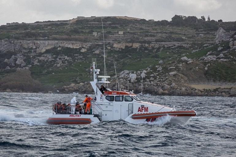 EUROPE-MIGRANTS-MALTA-DIPLOMACY Migrants sail towards Malta onboard a vessel of the Armed Forces of Malta (AFM) on January 9, 2019 after being transfered from the Dutch-flagged rescue Vessel
