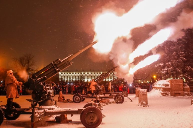 Russian army serviceman fire historical anti-aircraft guns to mark the 75th anniversary since the Leningrad siege was lifted during the World War Two in Saint Petersburg