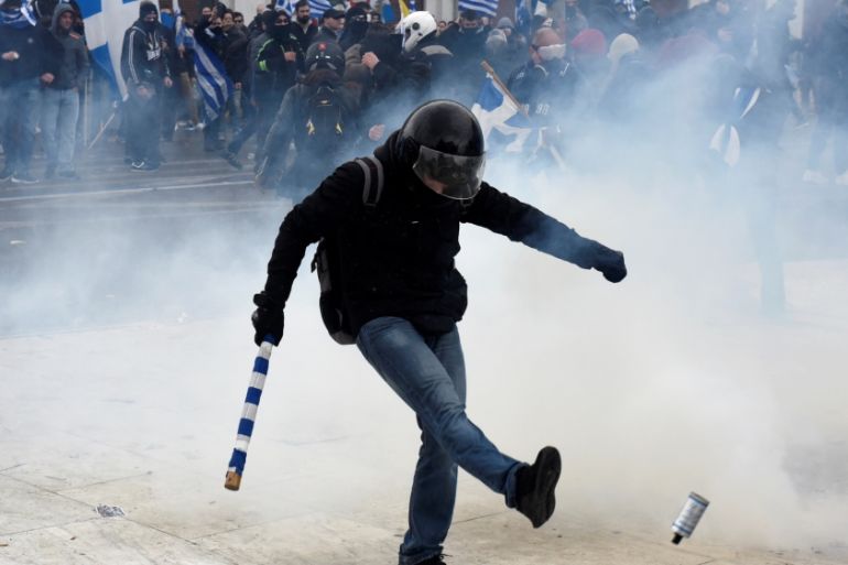 Protesters clash with police officers during a demonstration against the agreement reached by Greece and Macedonia to resolve a dispute over the former Yugoslav republic''s name, in Athens