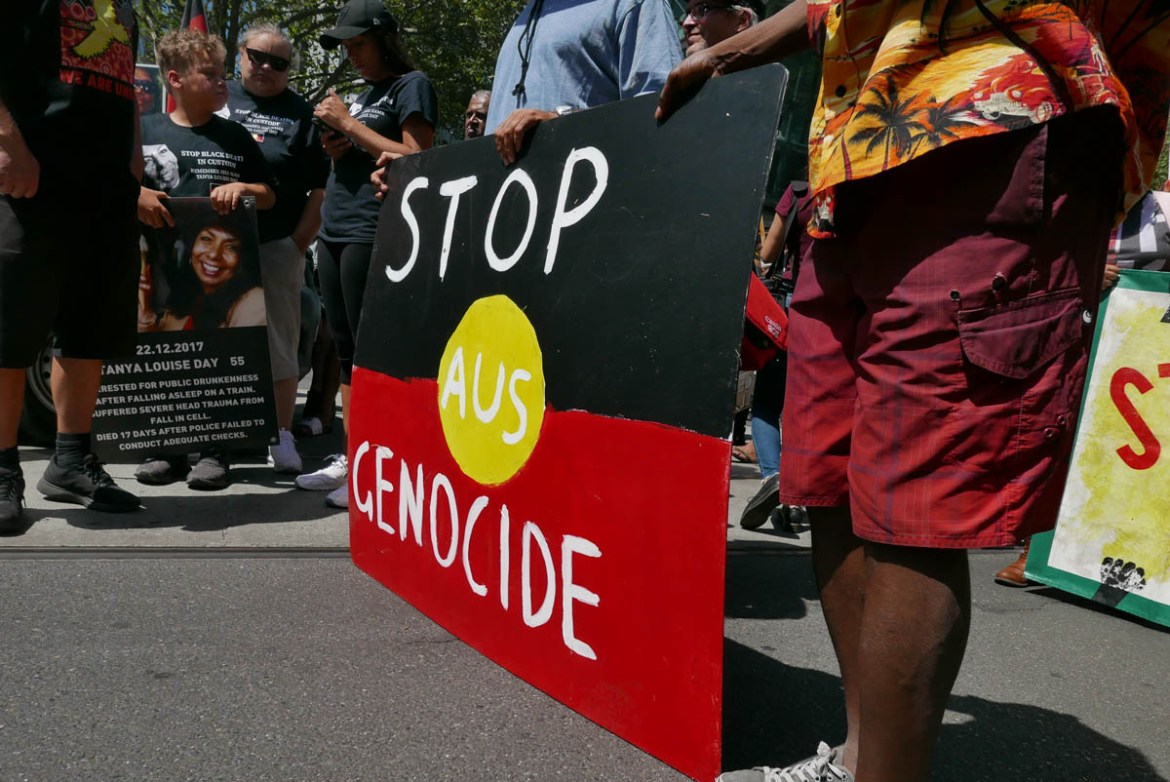 Many people also held placards with messages about the theme of the Invasion Day protest.