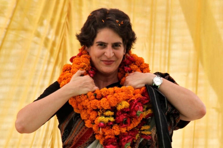 FILE PHOTO: Priyanka Gandhi Vadra adjusts her flower garlands during an election meeting at Rae Bareli
