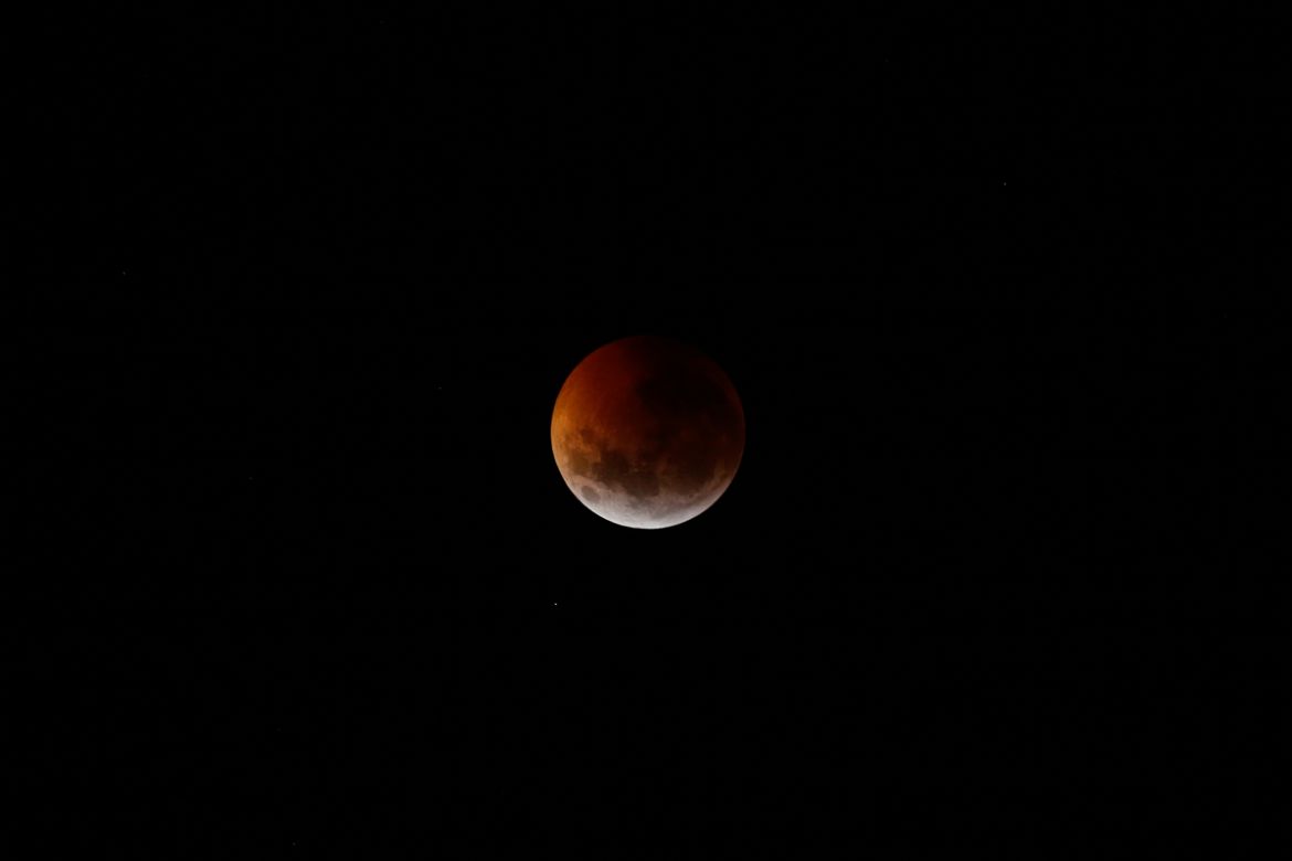 This photo shows the moon partially covered during a total lunar eclipse seen over Asuncion, Paraguay, Monday, Jan. 21, 2019. The entire eclipse will exceed three hours. Totality - when the moon''s com