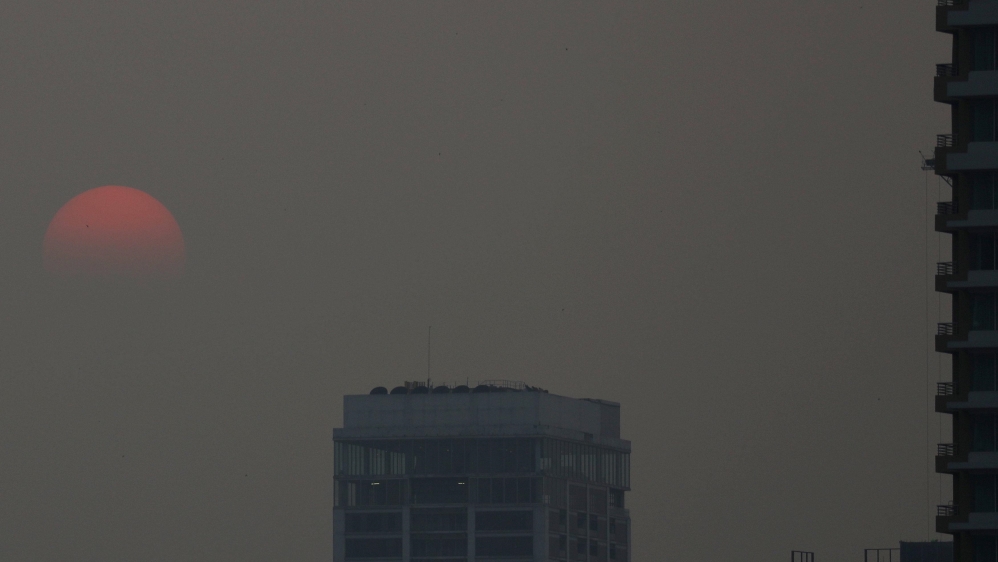 
The sunset is seen during a poor air quality day in Bangkok, Thailand [Jorge Silva/Reuters]
