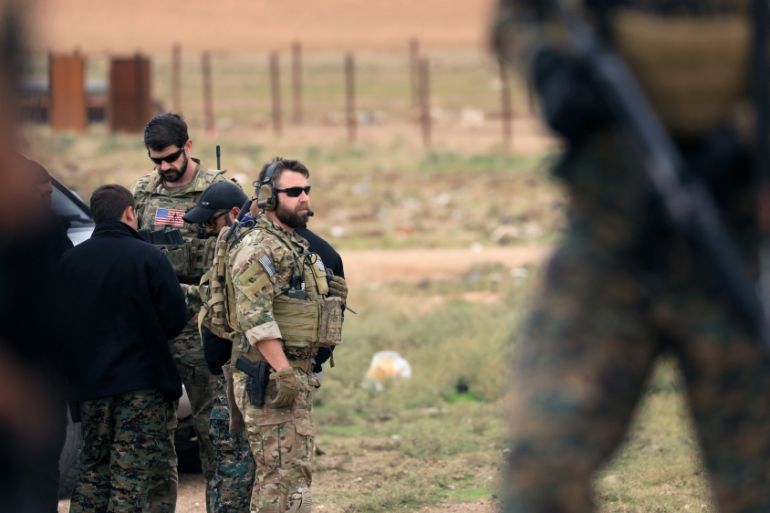 U.S. troops are seen during a patrol near Turkish border in Hasakah