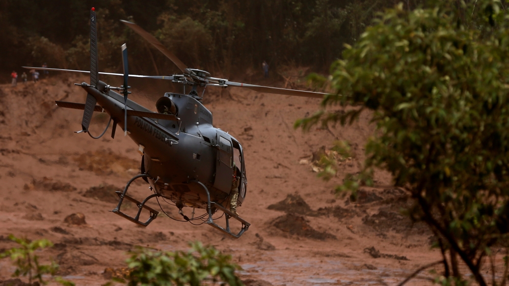 Authorities deployed helicopters as the thick mud was too treacherous for ground rescuers [Adriano Machado/Reuters]