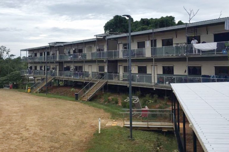 In this July 17, 2018, photo provided by Aziz Abdul, a man standing on a balcony at the East Lorengau Refugee Transit Center on Manus Island, Papua New Guinea.