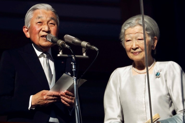 Japan''s Emperor Akihito, flanked by Empress Michiko, delivers a speech to well-wishers during a public appearance for New Year celebrations at the Imperial Palace in Tokyo