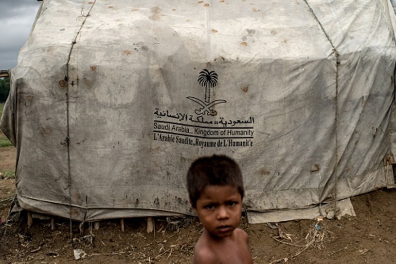 Myanmar''s Rohingya Population Struggle On After Mass Exodus SITTWE, BURMA - MAY 24: At one of the unregistered IDP camps stands a boy in front of a tent donated by Saudi Arabia, May 24, 2015 i