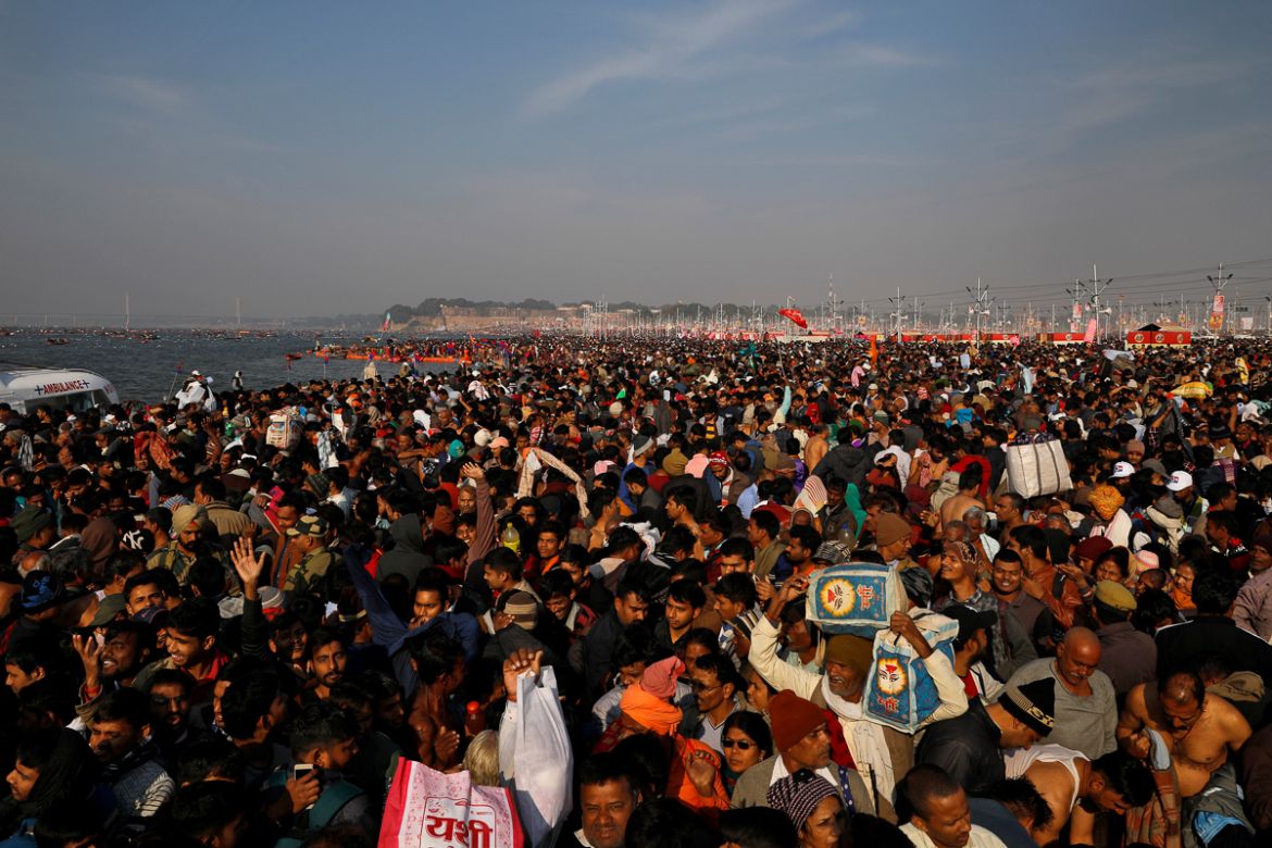 Devotees arrive to take a dip during the first "Shahi Snan" (grand bath) at "Kumbh Mela" or the Pitcher Festival, in Prayagraj, previously known as Allahabad, India, January 15, 2019. REUTERS/Danish S