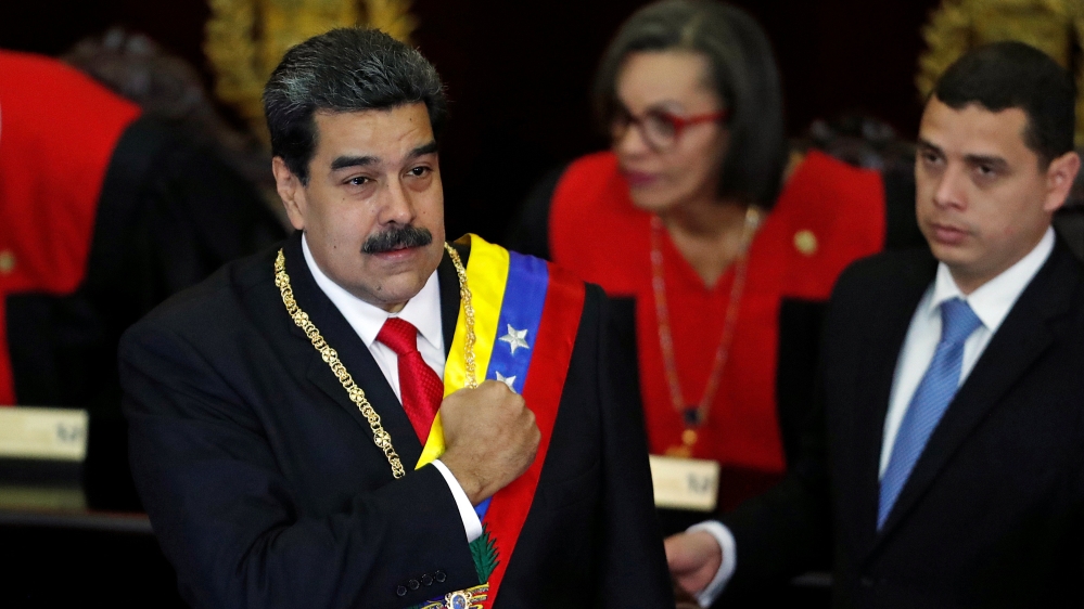 President Maduro gestures during a ceremony to mark the opening of the judicial year at the Supreme Court of Justice [Carlos Garcia/Reuters]