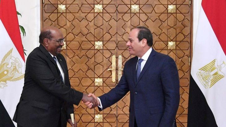 Egyptian President Abdel Fattah al-Sisi shakes hands with Sudan''s President Omar al-Bashir at the Ittihadiya presidential palace in Cairo