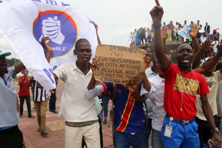 Supporters of Martin Fayulu, chant slogans as he delivers his appeal contesting the CENI results of the presidential election at the constitutional court in Kinshasa