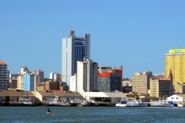 Fishing boats sit beneath the skyline of Mozambique''s capital Maputo