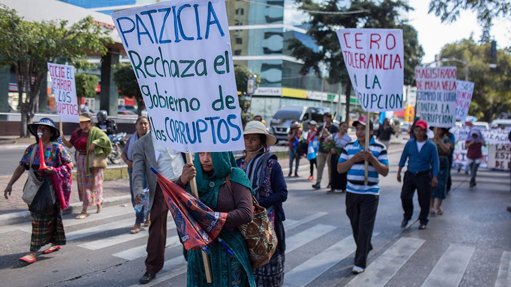 Residents from Patzicia, Chimaltenango march in the protest rejecting Morales' actions against CICIG [Jeff Abbott/Al Jazeera]