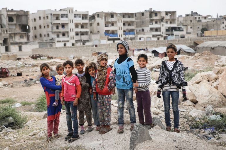 Children stand in the outskirts of al-Bab, northern Syria [File:Lefteris Pitarakis/AP Photo]