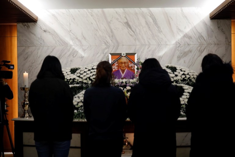 People mourn at the funeral of former South Korean "comfort woman" Kim Bok-dong in Seoul