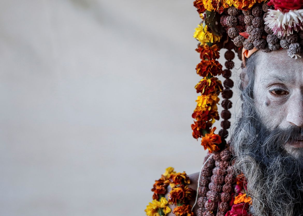 A Naga Sadhu or Hindu holy man waits for devotees inside his camp during "Kumbh Mela" or the Pitcher Festival, in Prayagraj, previously known as Allahabad, India January 17, 2019. REUTERS/Danish Siddi