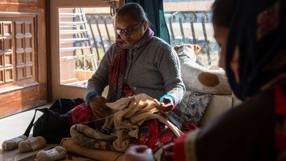 
The knitters have been able to send their children to school, extend and improve their homes and buy furniture and jewellery [Maria de la Guardia/Al Jazeera]
